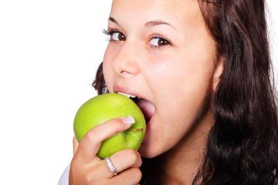 She is eating an apple