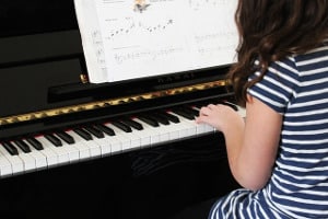 girl playing piano