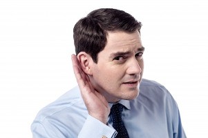 man hand behind ear