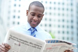 man reading newspaper